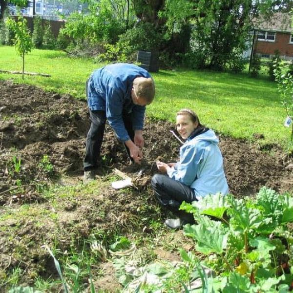A father and daughter gardening together